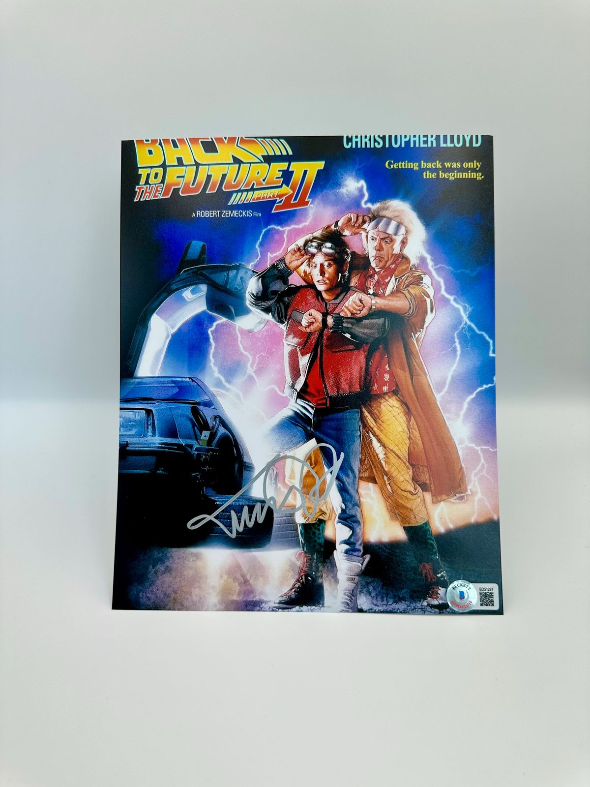 Michael J. Fox Fotografía autografiada “Volver al Futuro”, firma certificada por la compañía Beckett con el número BD51291